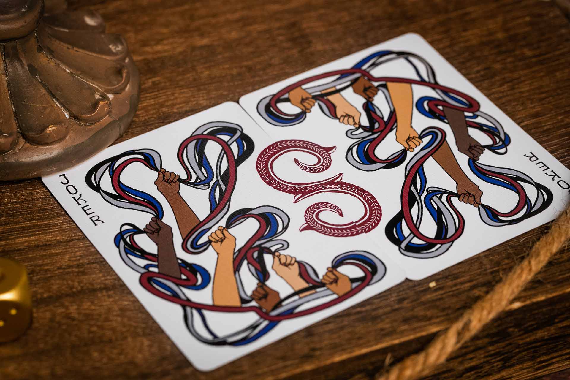 The two Joker cards form a single design when placed together.